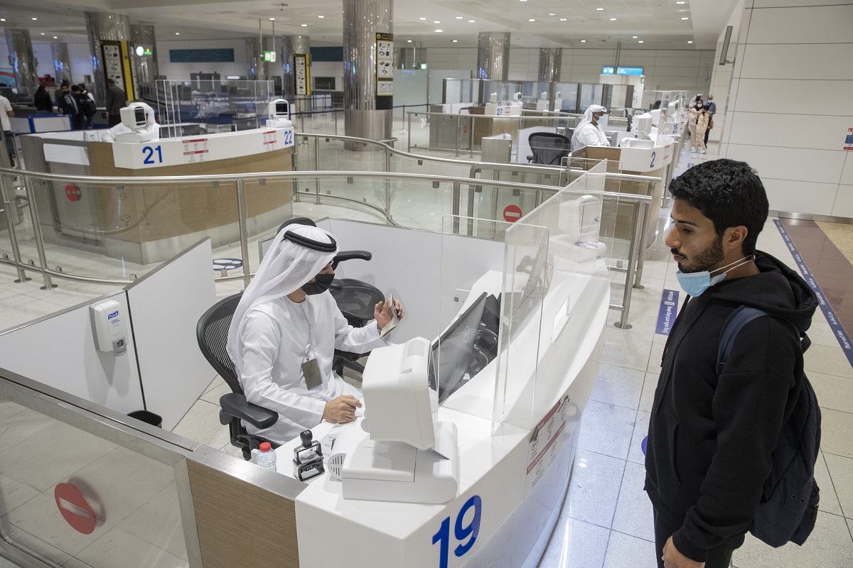 Passenger traffic at Dubai Airports Terminal 3. GDRFA Dubai officers in action at the Passport control area along with passenger movement in Dubai Airports Terminal 3.
Antonie Robertson/The National